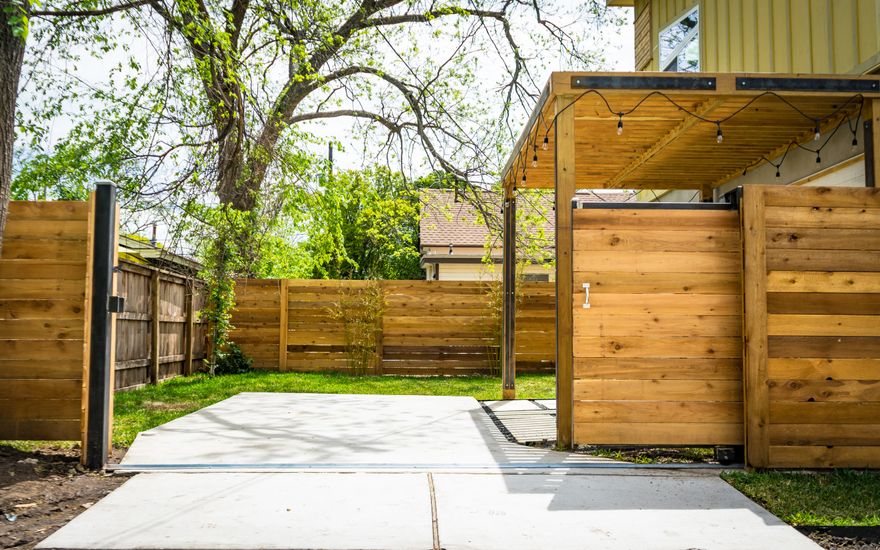 Cedar privacy fence enclosing a landscaped back garden